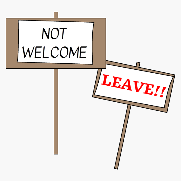 Placards saying 'Not Welcome' and 'Leave!!'