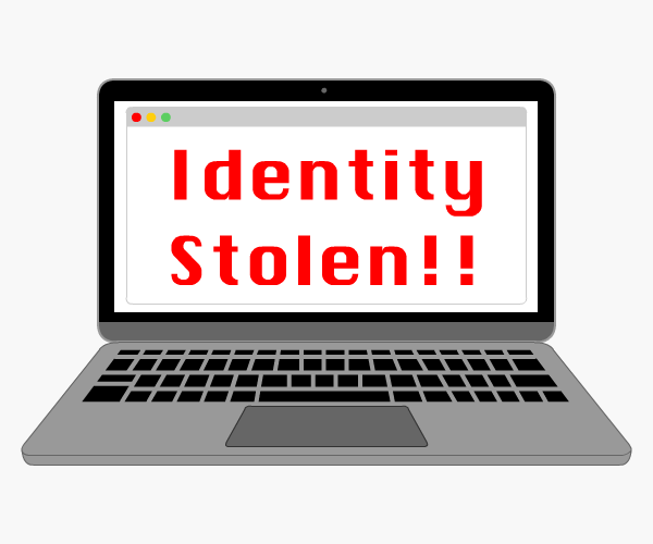 Laptop screen displaying 'Identity Stolen!!''