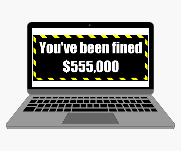 Laptop with 'You've been fined $555,000' on the screen
