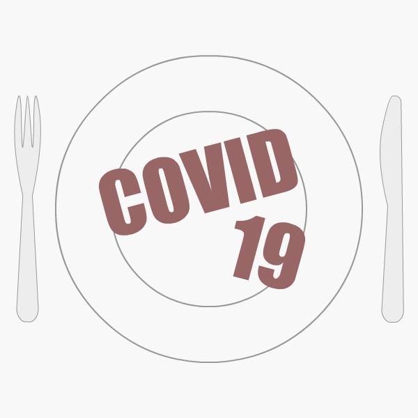 'COVID-19' on plate between knife and fork