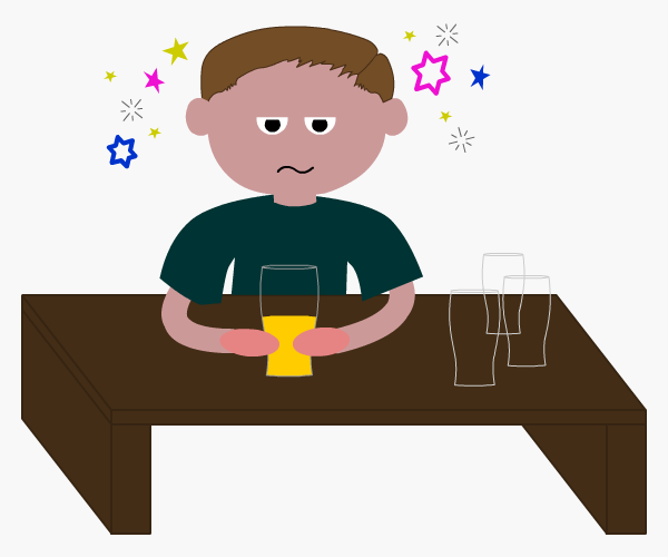 Drunk young man drinking a pint of beer with three empty glasses on the table